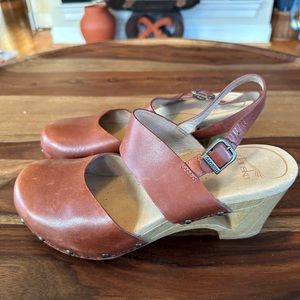 Dansko Thea brown leather cut out clogs. .